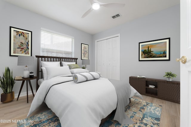 bedroom featuring light wood-type flooring, a closet, and ceiling fan