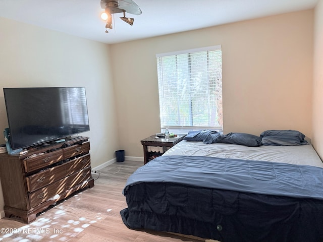 bedroom featuring light hardwood / wood-style floors and ceiling fan