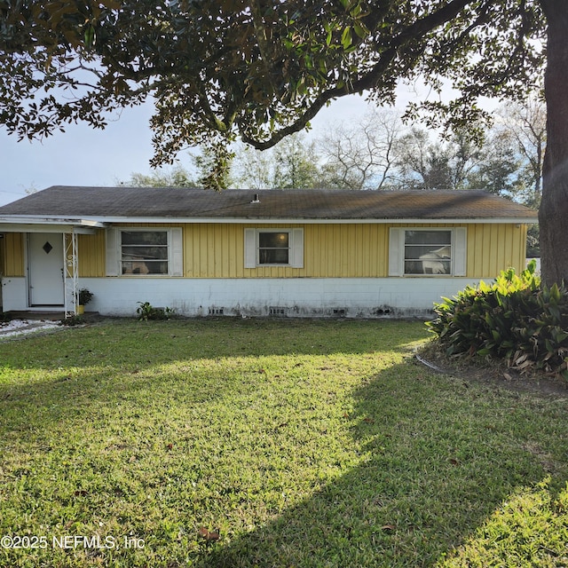 ranch-style house with a front lawn