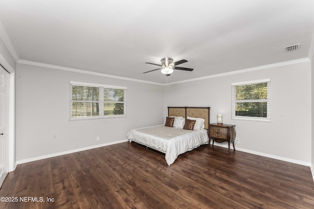 unfurnished bedroom with a closet, ceiling fan, crown molding, and dark wood-type flooring