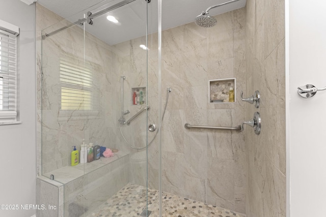 bathroom with a shower with shower door