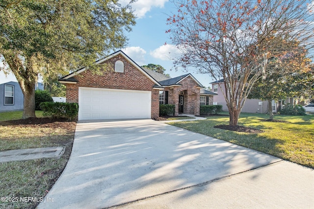 view of property with a garage and a front yard