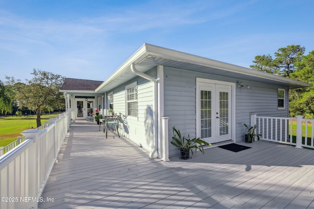 wooden deck featuring french doors