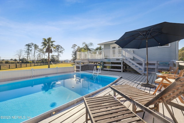 view of pool with a wooden deck