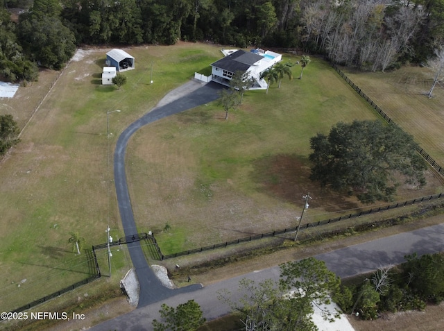 birds eye view of property with a rural view