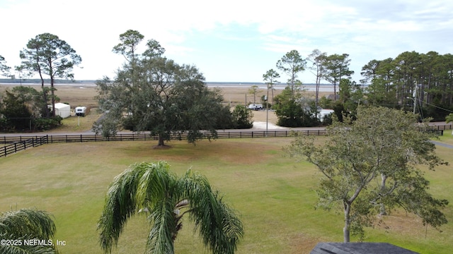 view of yard with a rural view