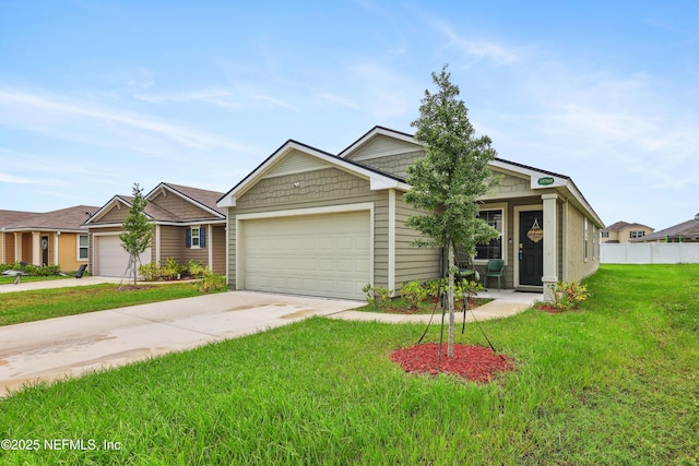 view of front of home with a garage and a front yard