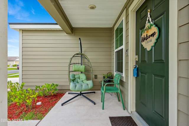 doorway to property featuring covered porch