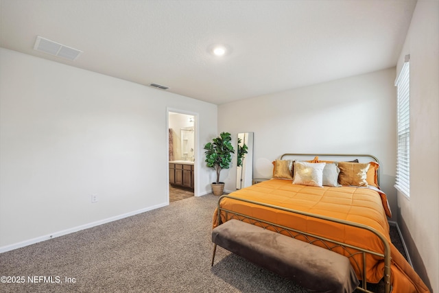 carpeted bedroom with connected bathroom