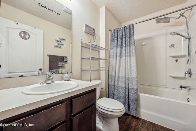 full bathroom featuring shower / bath combination with curtain, vanity, a textured ceiling, wood-type flooring, and toilet