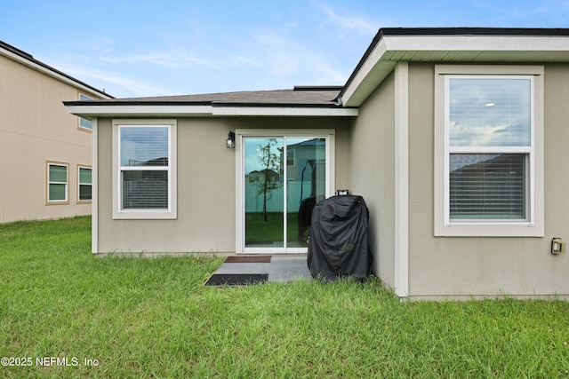 back of house with a yard