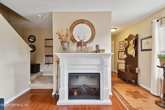 room details with wood-type flooring and a textured ceiling