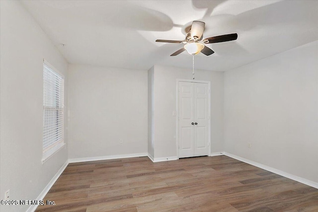 unfurnished room featuring wood-type flooring and ceiling fan