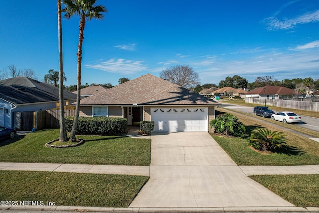 ranch-style house featuring a front lawn and a garage