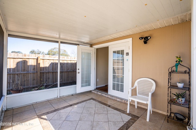 sunroom featuring wood ceiling