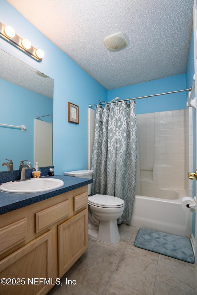 full bathroom featuring toilet, vanity, shower / bathtub combination with curtain, and a textured ceiling