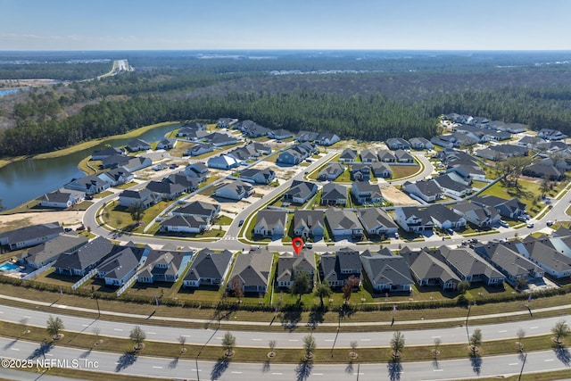 aerial view with a water view and a residential view