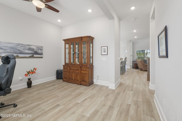 home office featuring ceiling fan and light wood-type flooring