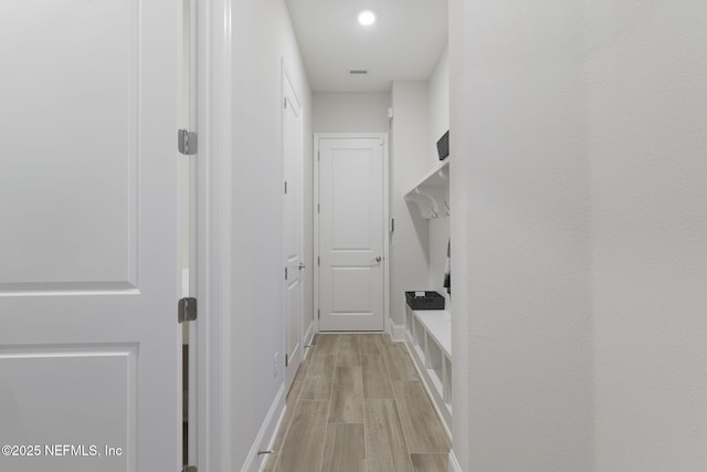 mudroom featuring light wood-style floors