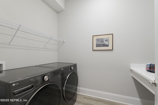 laundry room featuring washing machine and dryer