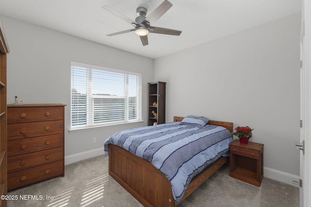 bedroom featuring a ceiling fan, carpet, and baseboards