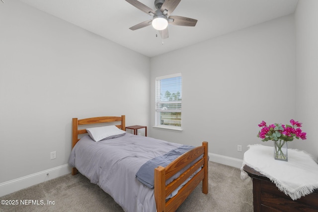 bedroom with ceiling fan and light carpet