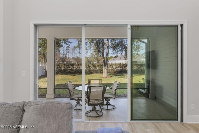 entryway with wood finished floors and a wealth of natural light