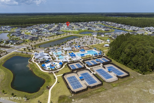 birds eye view of property featuring a water view and a residential view