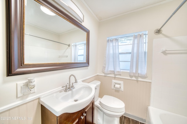 full bathroom with shower / washtub combination, hardwood / wood-style floors, ornamental molding, vanity, and toilet