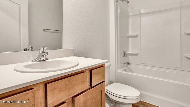 full bathroom with vanity, bathing tub / shower combination, and toilet