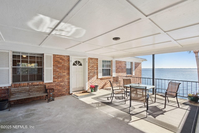 sunroom / solarium with a water view