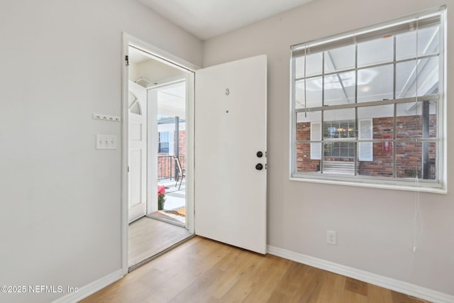 foyer featuring a healthy amount of sunlight and light wood-type flooring