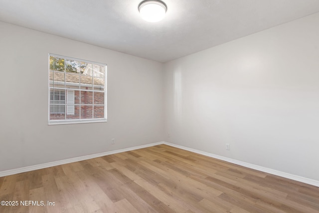 unfurnished room featuring light hardwood / wood-style flooring