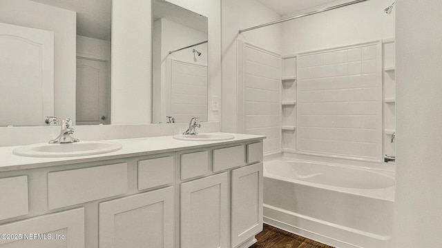 bathroom featuring bathing tub / shower combination, vanity, and wood-type flooring