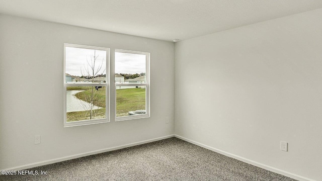 unfurnished room with carpet flooring