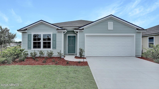 ranch-style house with a garage and a front lawn