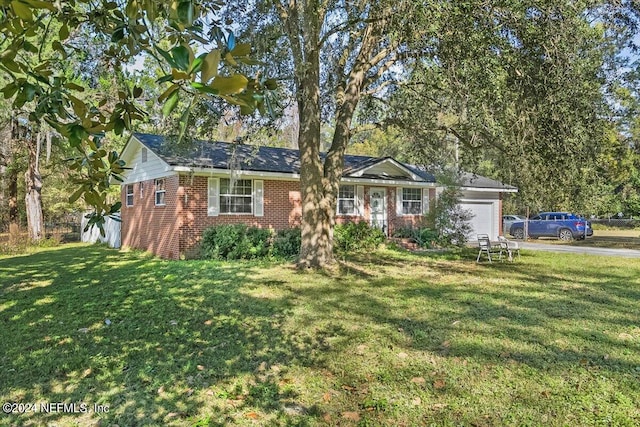 single story home with a garage and a front lawn