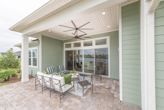 view of patio featuring an outdoor living space and ceiling fan