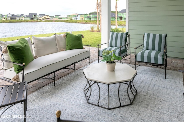 view of patio / terrace featuring a water view and an outdoor hangout area