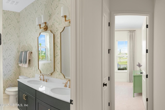 bathroom with vanity and toilet