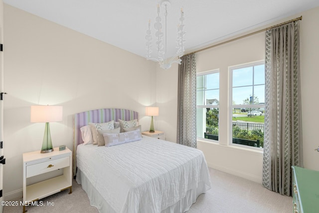 carpeted bedroom featuring multiple windows