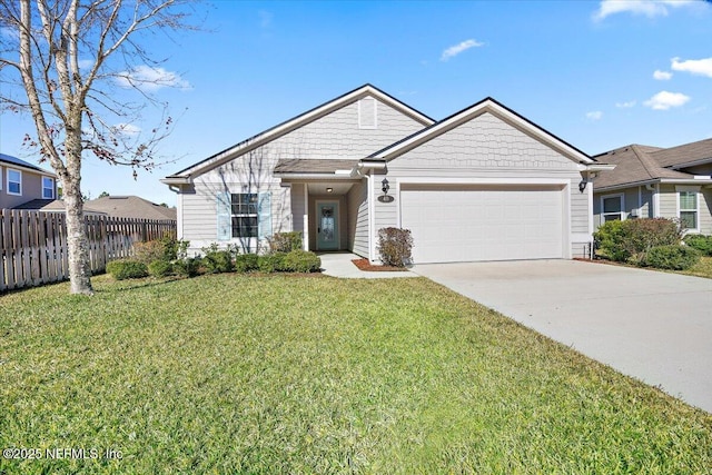 view of front of home featuring a front yard and a garage