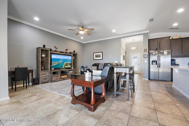 living room featuring ceiling fan, ornamental molding, and light tile patterned floors