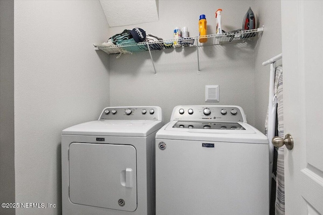 washroom featuring separate washer and dryer