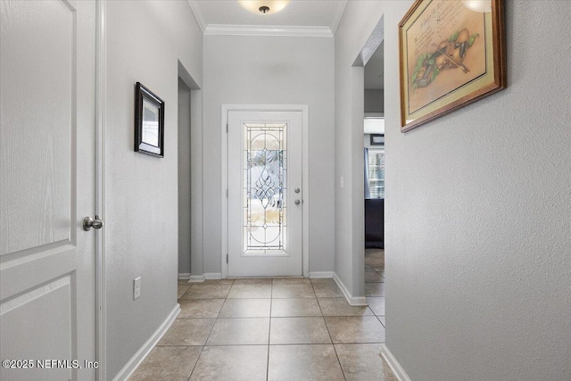 doorway with ornamental molding and light tile patterned floors