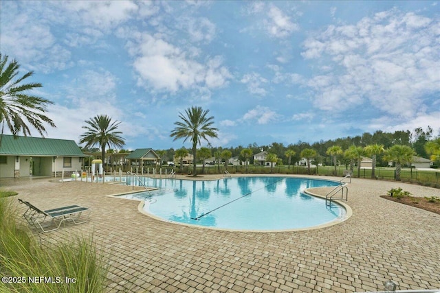 view of swimming pool with a patio area