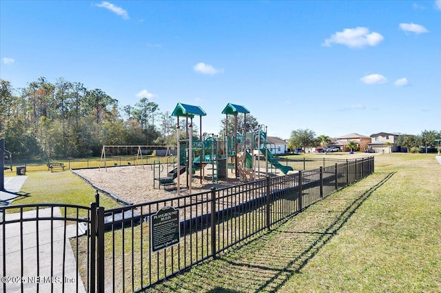 view of playground with a lawn