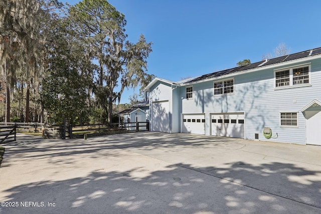 view of property exterior featuring a garage