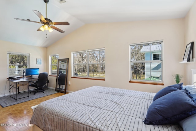 bedroom featuring parquet floors, ceiling fan, and lofted ceiling