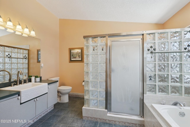 full bathroom featuring toilet, separate shower and tub, vaulted ceiling, a textured ceiling, and vanity